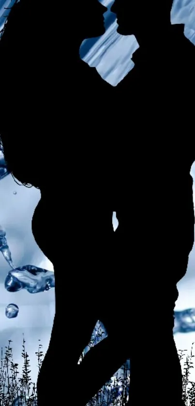 Silhouetted couple embracing with blue water background.