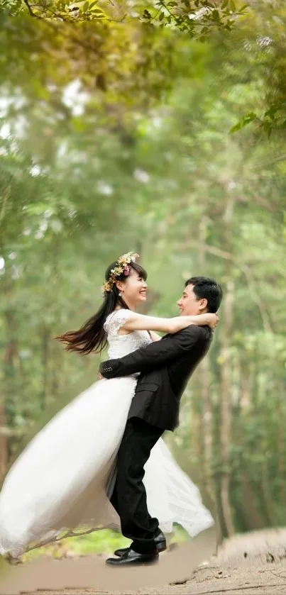 A couple in wedding attire embraces in a romantic forest setting with lush greenery.