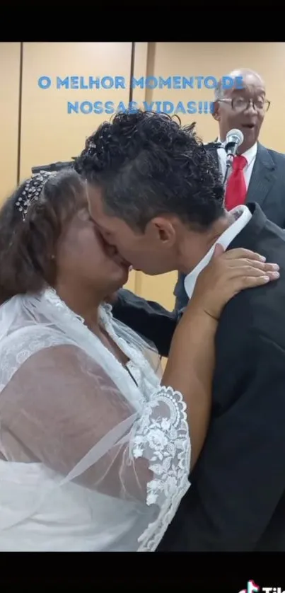 A bride and groom share a romantic wedding kiss.