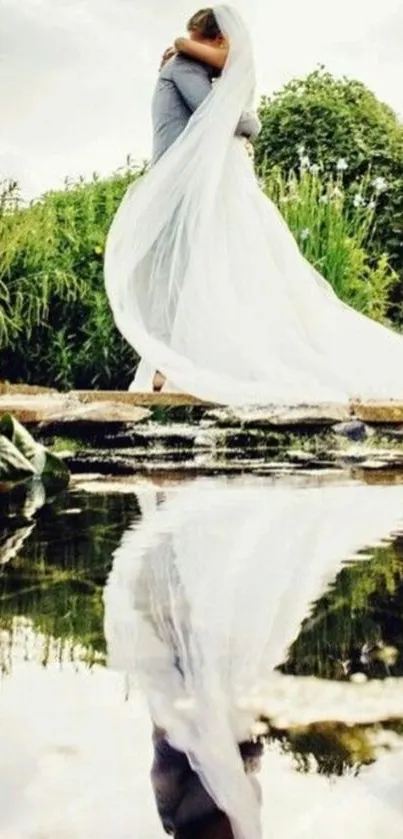 Wedding couple embracing by a pond.