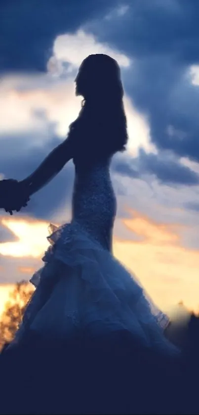 Silhouetted couple holding hands at sunset in a romantic setting.