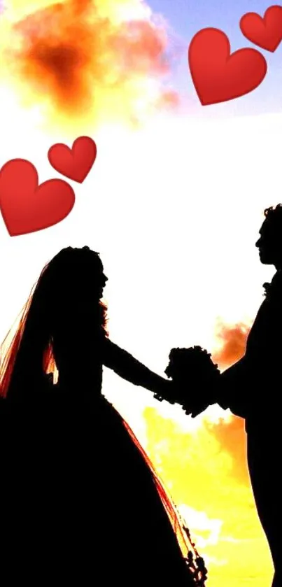 Silhouette of a couple with hearts in a sunset sky background.