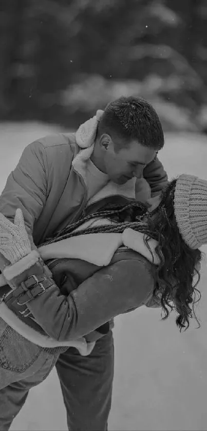 Couple embracing in a snowy winter landscape, perfect for romantic wallpapers.