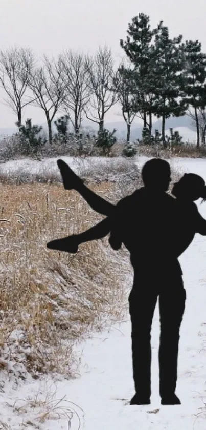 Silhouette of couple on snowy winter path with trees.