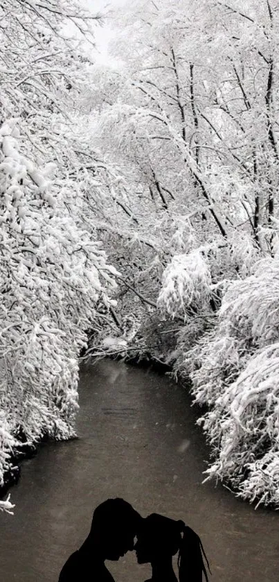 Silhouette couple in snowy winter wonderland by a river.