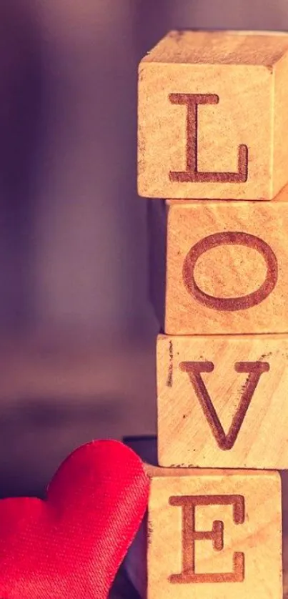 Wooden blocks spelling 'LOVE' with red heart.