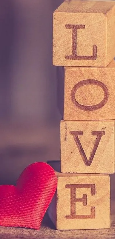 Wooden blocks spelling LOVE with a red heart.