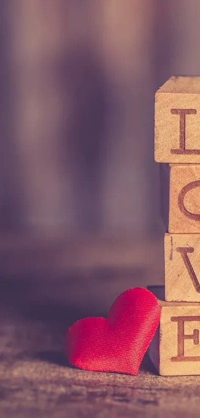 Wooden blocks spelling 'Love' with red heart on rustic background.