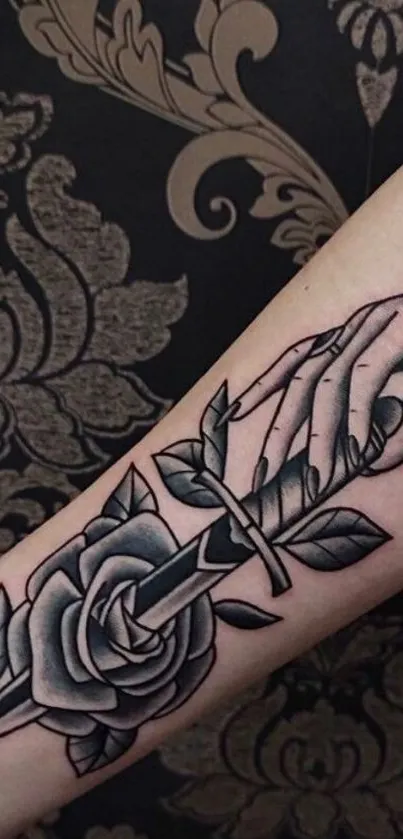 Rose and dagger tattoo art on forearm.