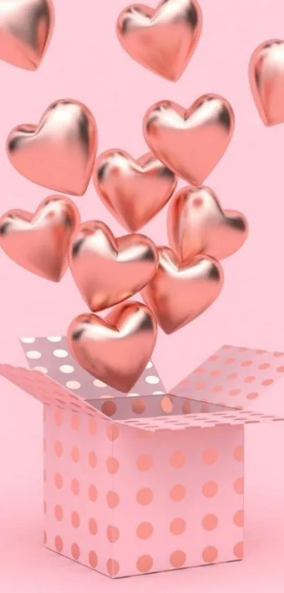 Rose gold hearts emerging from polka dot box against pink background.