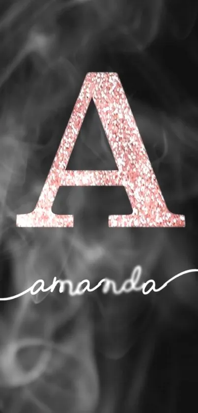 Rose gold glitter letter A on smoky dark background.