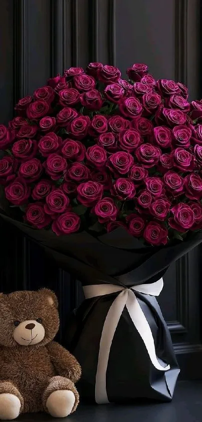 Bouquet of red roses with a teddy bear on a dark background.