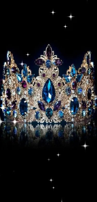 Ornate crown with blue gemstones on black background.