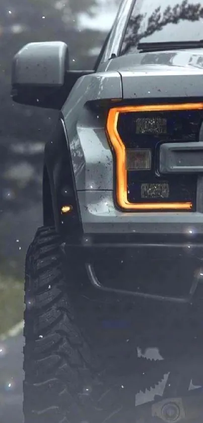 Rugged off-road truck with glowing headlights on a misty road.