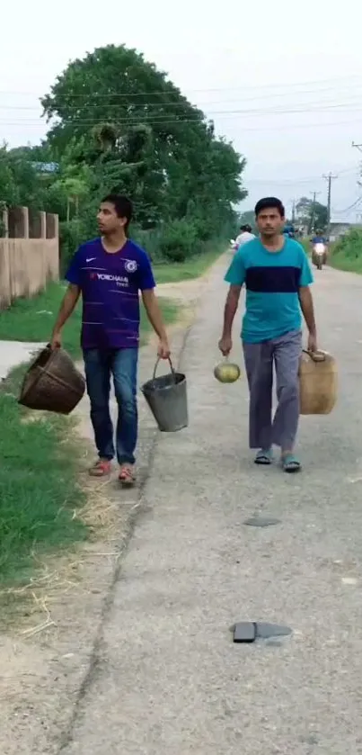 Two people carrying buckets on a rural road.