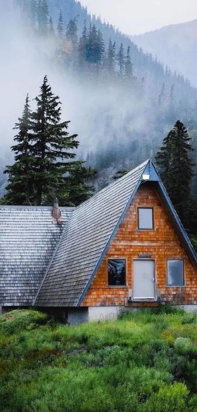 A rustic A-frame cabin surrounded by misty mountains and lush greenery.