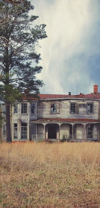 Abandoned house in a rural setting with trees and blue sky.