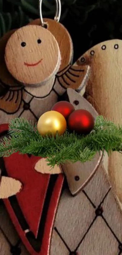 Rustic wooden angel with Christmas ornaments and greenery.