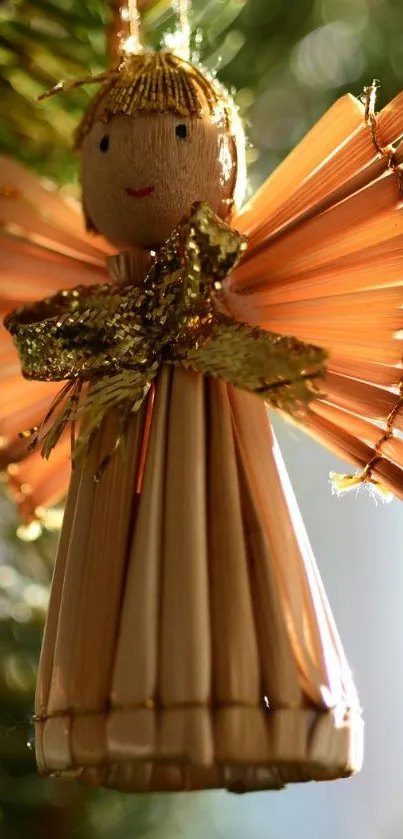 Charming straw angel Christmas ornament with golden hues.