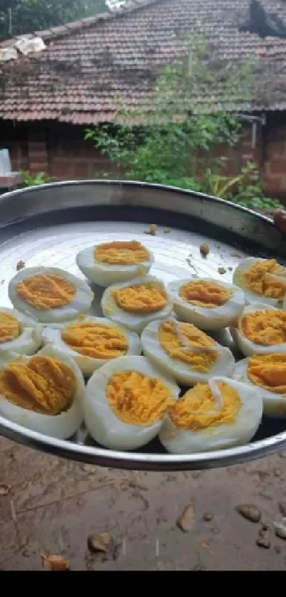 Platter of boiled eggs in a rustic village setting