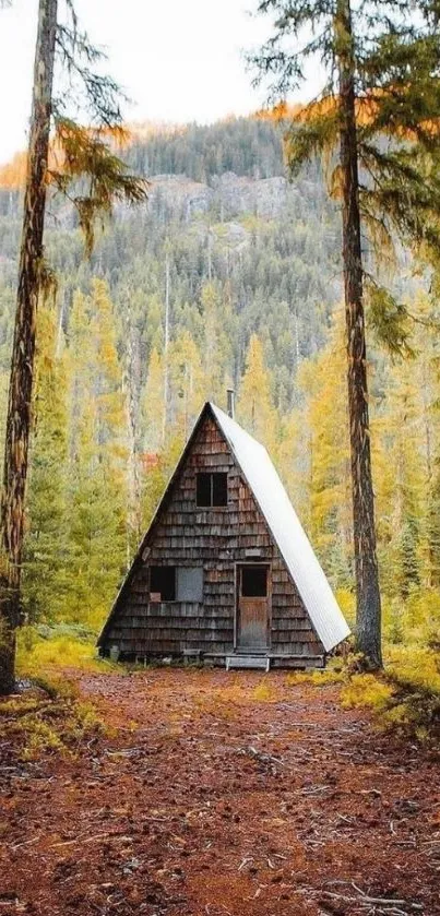 A-frame cabin in autumn forest setting.