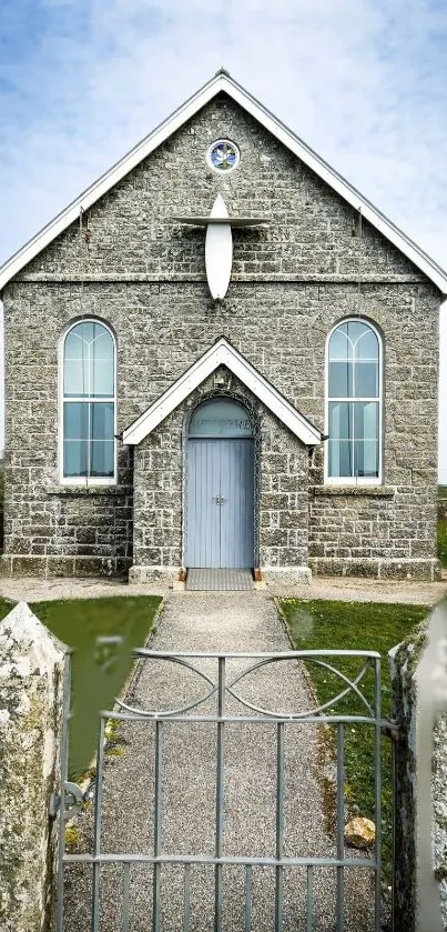 Rustic stone church with blue sky.