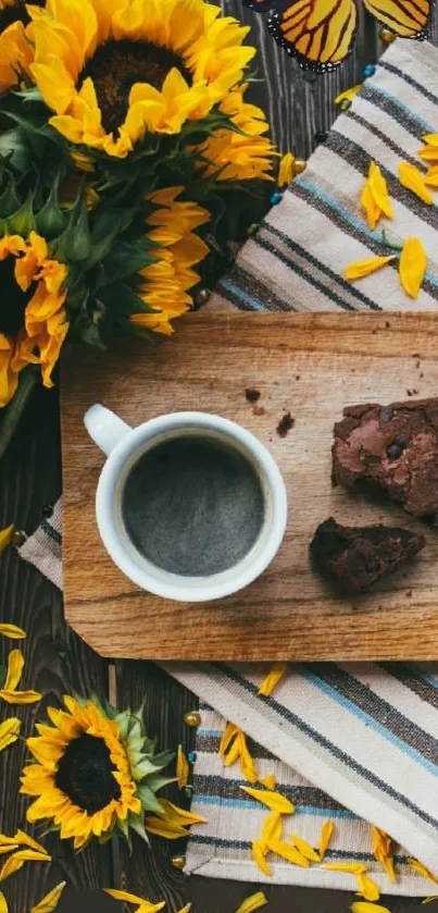 A cup of coffee with brownies and sunflowers on a rustic wooden board.