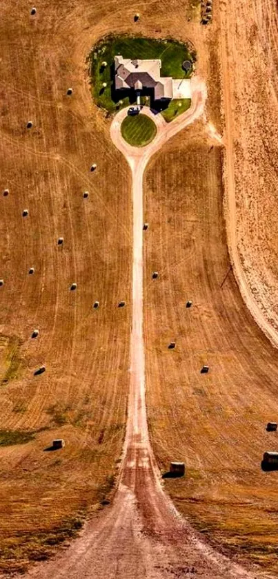 Aerial view of a rustic countryside with a home and farmland, ideal for mobile wallpaper.