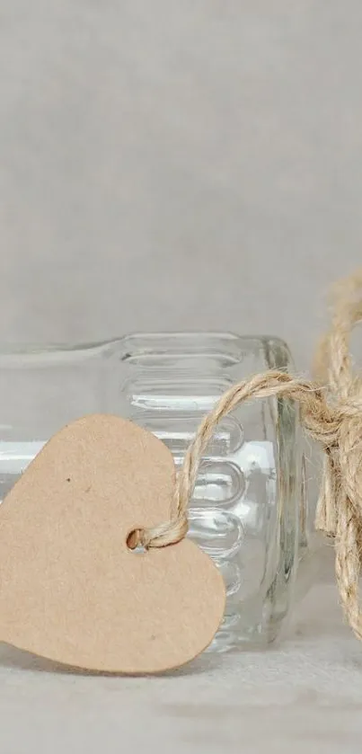 Rustic heart tag on a glass bottle with a natural twine bow.