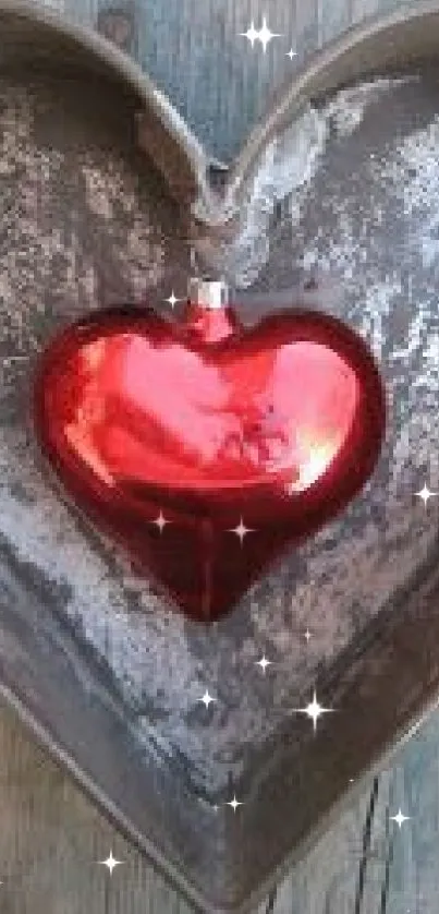 Rustic metal heart with red heart accent on wood surface.