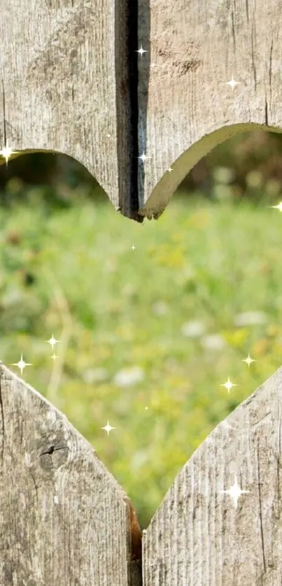 Heart-shaped cutout in wood showing a green field.