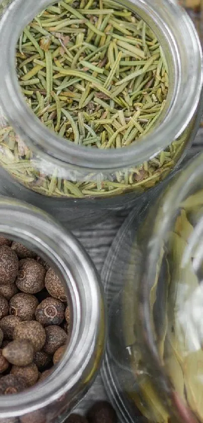 Rustic spice jars filled with assorted herbs and spices on a wooden table.