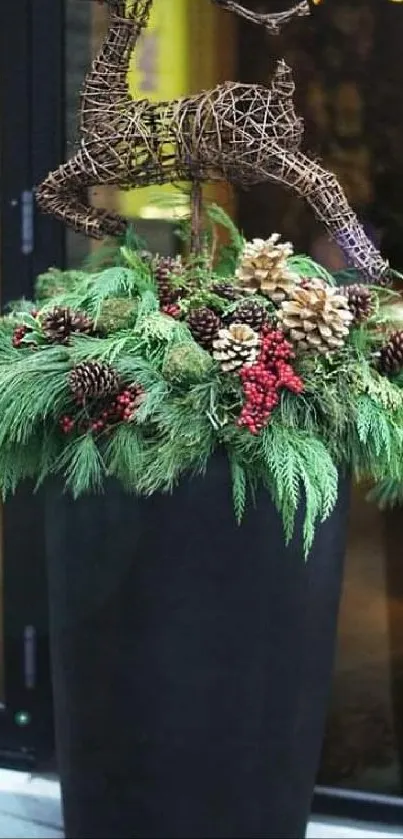 Reindeer sculpture with pinecones and greenery in a black planter.