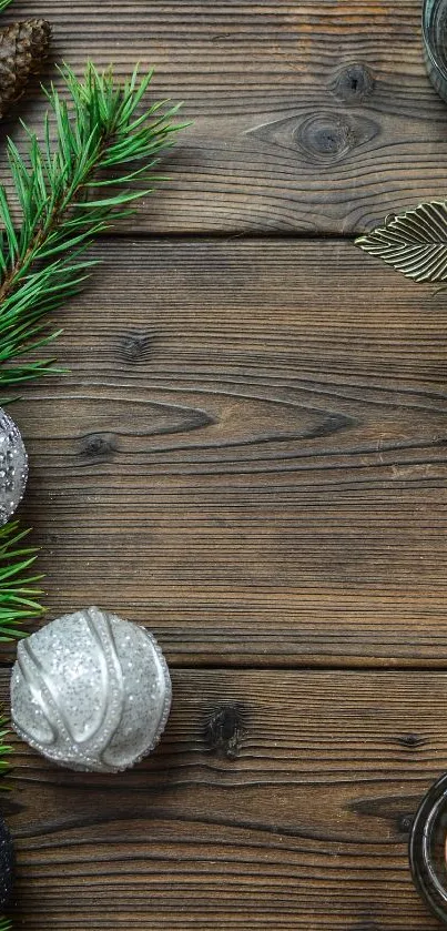 Rustic wooden background with holiday decor, ornaments, and candles.