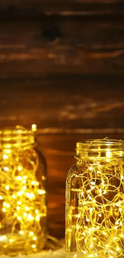 Mason jars with glowing fairy lights against a wooden background.