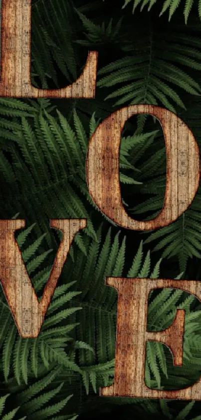 Wooden 'Love' letters on green ferns wallpaper.