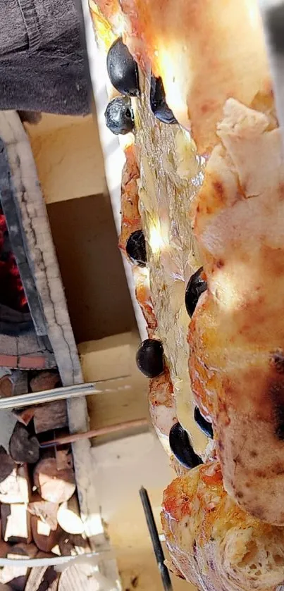 Close-up of wood-fired pizza with olives.