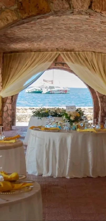 A rustic seaside wedding venue with stone arches and ocean view.