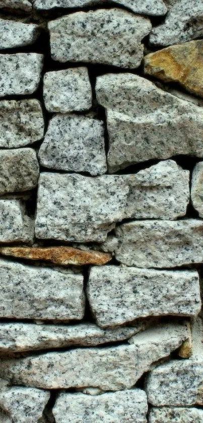 Textured stone wall wallpaper with rustic and earthy tones.