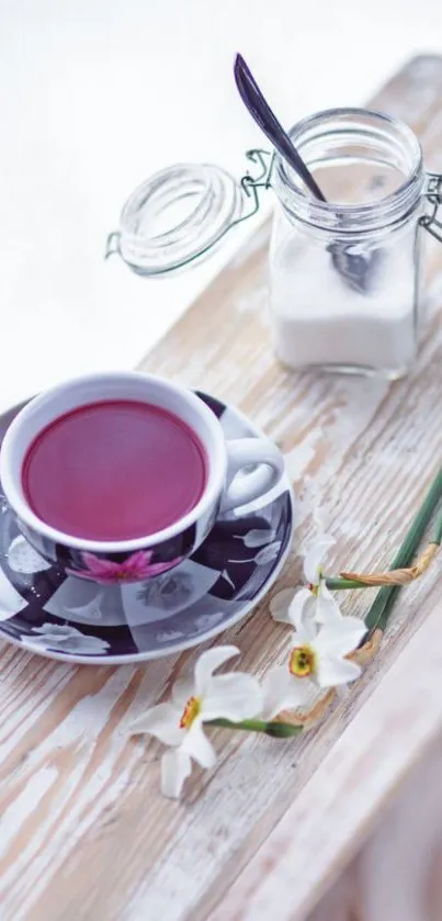 Purple tea on a rustic table with daffodils and a sugar jar.