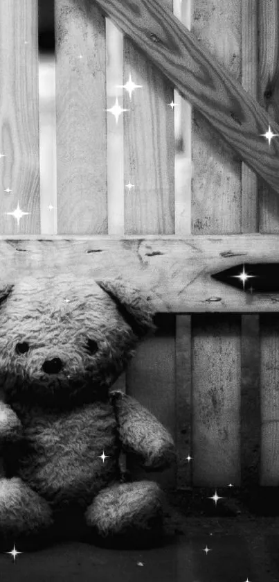 Monochrome teddy bear against wooden barn backdrop.