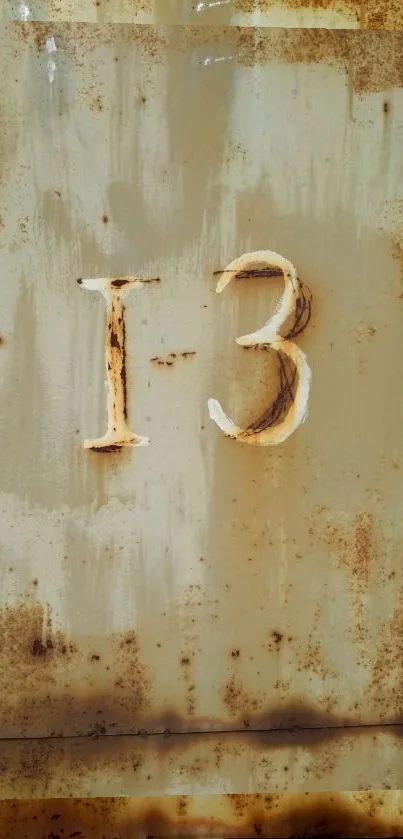 Vintage wallpaper featuring rustic number 13 with earthy tones.