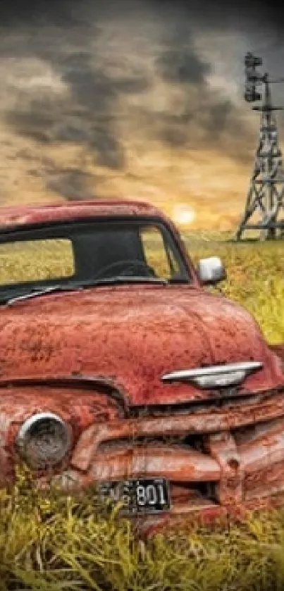 Vintage truck in a golden field under a dramatic sky at sunset.