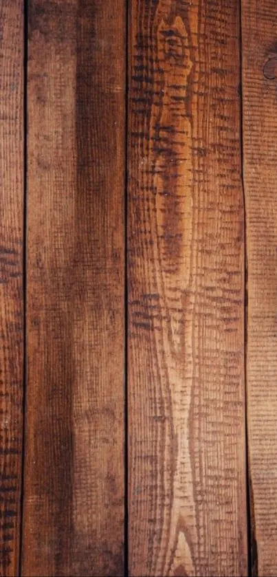 Rustic wooden planks with a natural brown texture, perfect for mobile wallpaper.