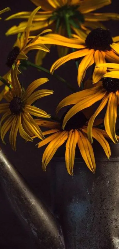 Yellow flowers in a metal watering can on dark background.