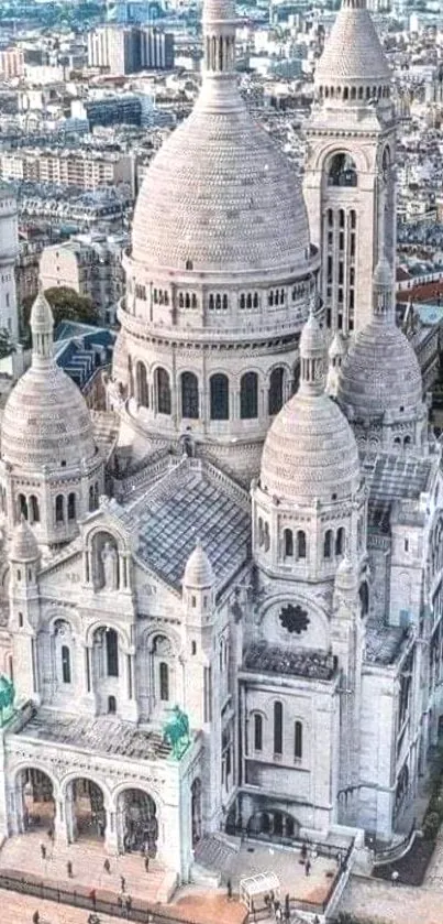 Aerial view of Sacre Coeur Basilica in Paris with city backdrop.