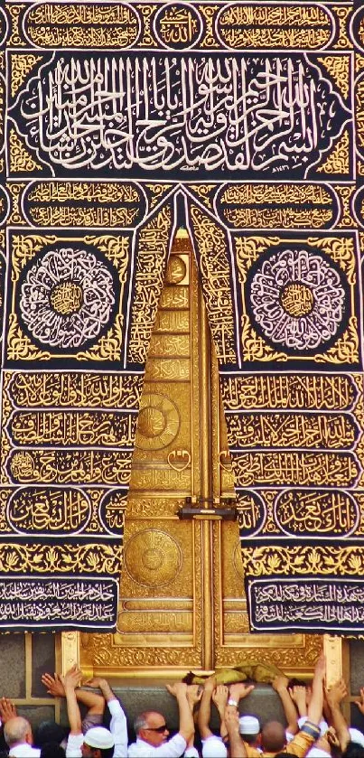 Close-up of the sacred Kaaba door with intricate golden designs.