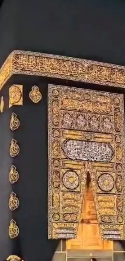 Close-up of the Kaaba with gold ornamentation and black fabric. Iconic Islamic site.