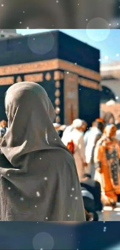 A person gazing at the Kaaba during pilgrimage.