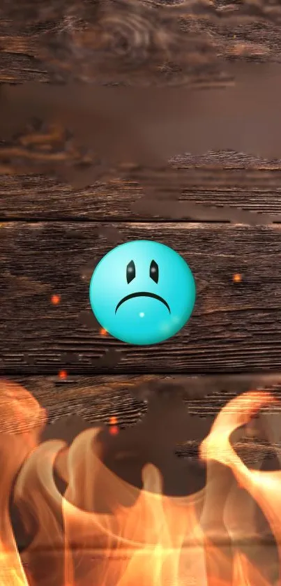 Sad blue emoji on fiery wooden background with flames.